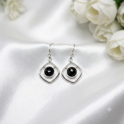 Black Onyx Geometric Earrings in 925 Sterling Silver with faceted round Black Onyx gemstones.