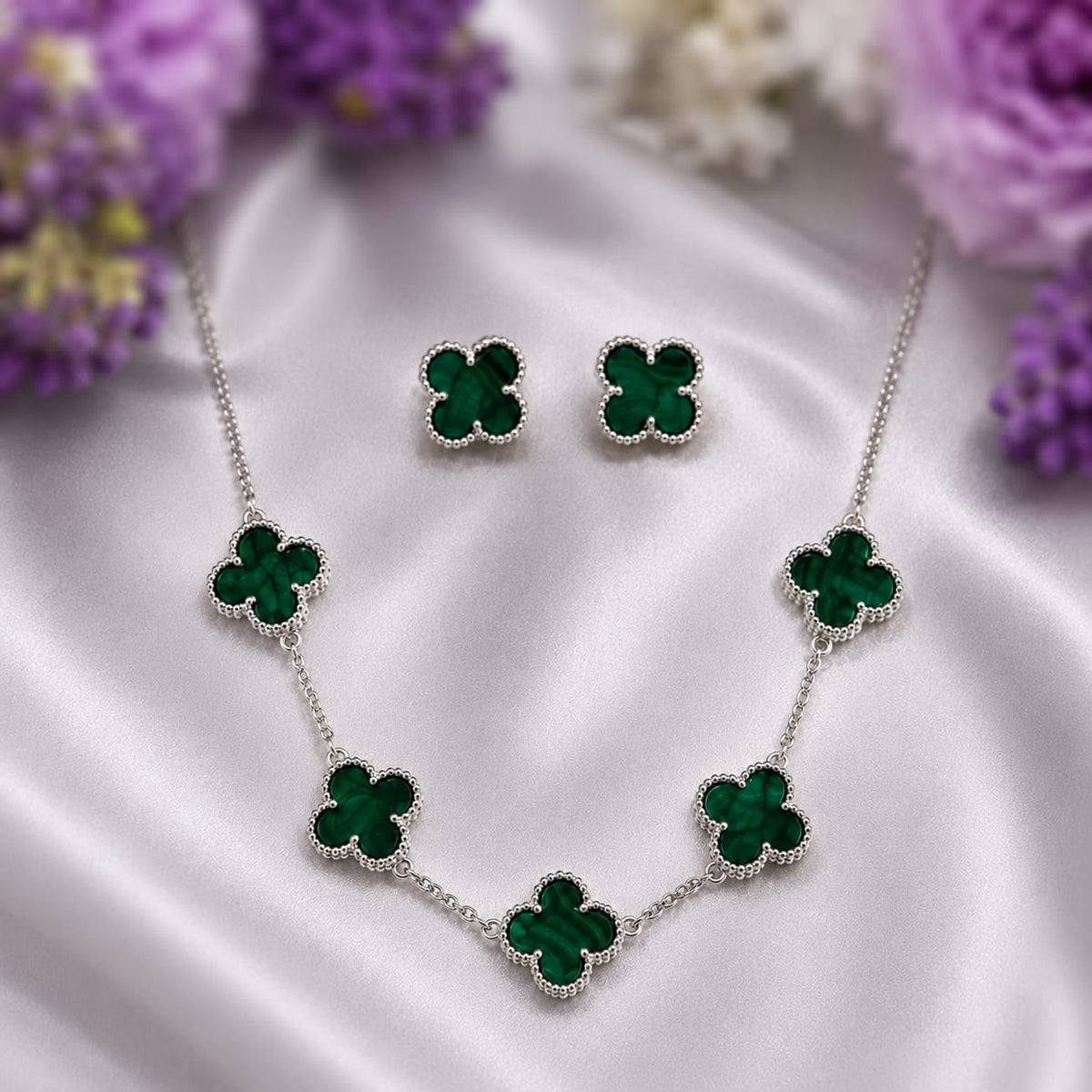 Green Malachite Clover Jewelry Set in 925 Sterling Silver featuring a matching clover necklace and stud earrings.