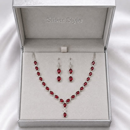 Red Ruby Classic Necklace and Earrings Set in 925 Sterling Silver featuring oval-cut Red Ruby gemstones with matching earrings.