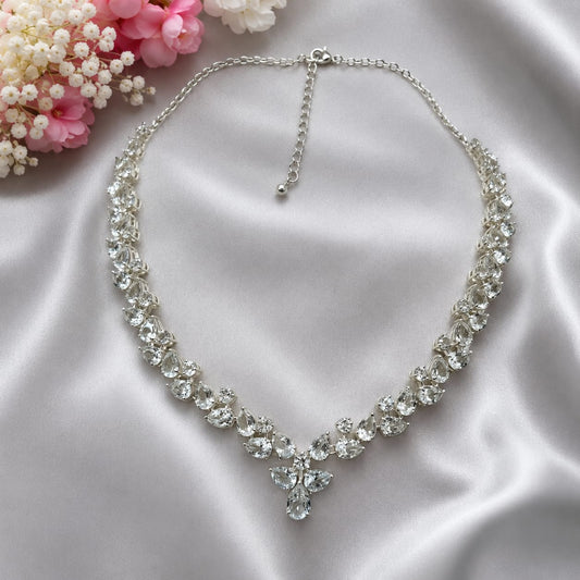 White Topaz Floral Statement Necklace in 925 Sterling Silver featuring pear-cut and round White Topaz gemstones arranged in a floral vine design.
