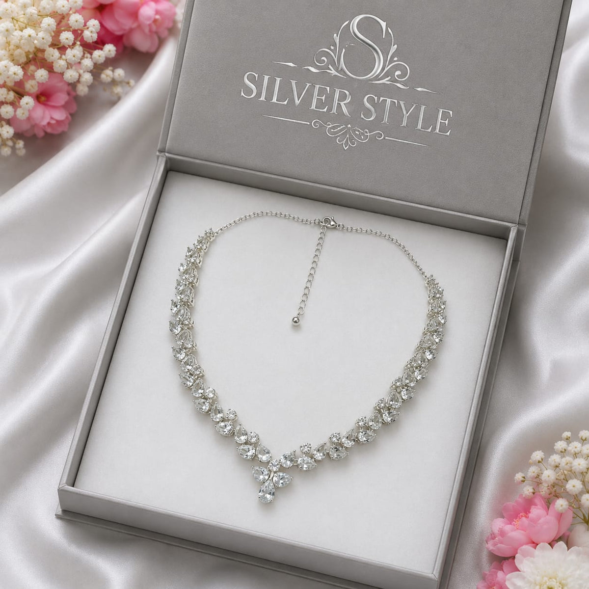 White Topaz Floral Statement Necklace in 925 Sterling Silver featuring pear-cut and round White Topaz gemstones arranged in a floral vine design.