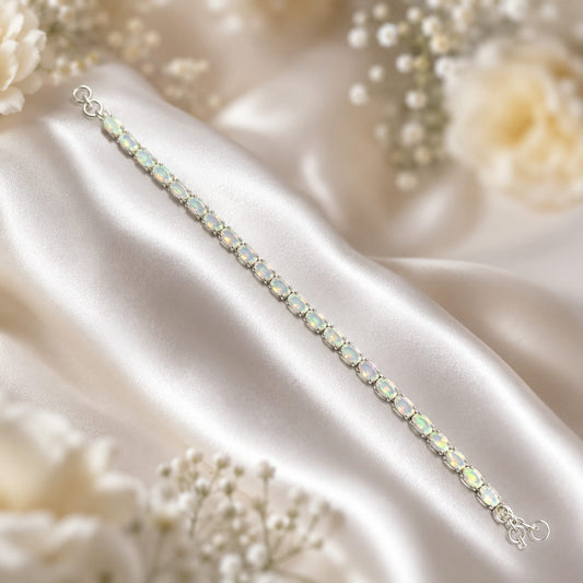 White Opal Tennis Bracelet in 925 Sterling Silver worn on wrist