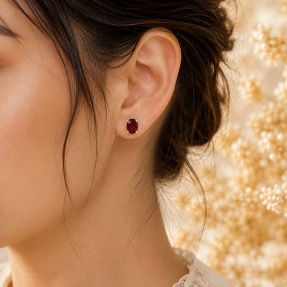 Oval red Garnet ear studs in 925 Sterling Silver with four-prong setting