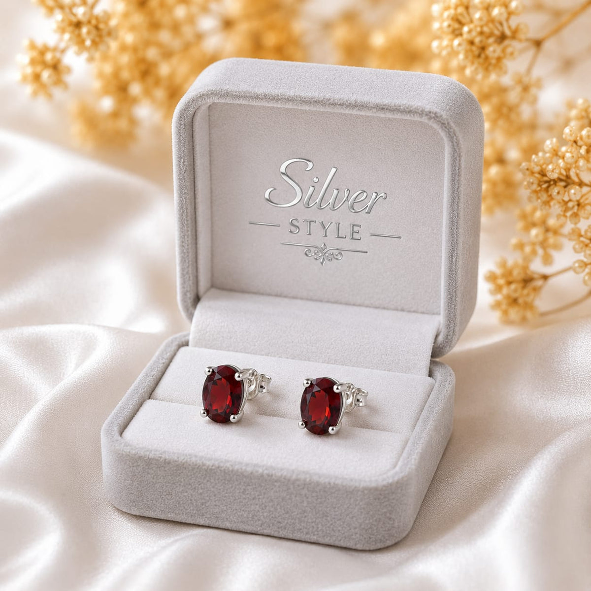 Oval red Garnet ear studs in 925 Sterling Silver with four-prong setting