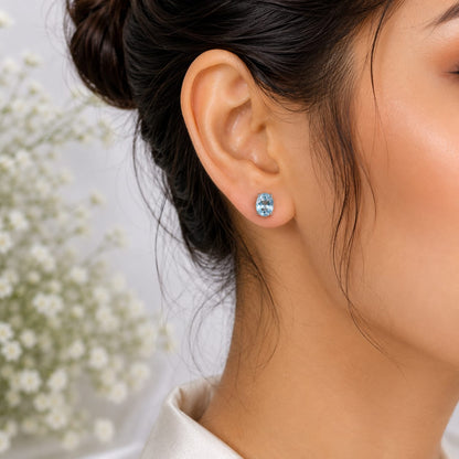 Oval blue Blue Topaz ear studs in 925 Sterling Silver with four-prong setting