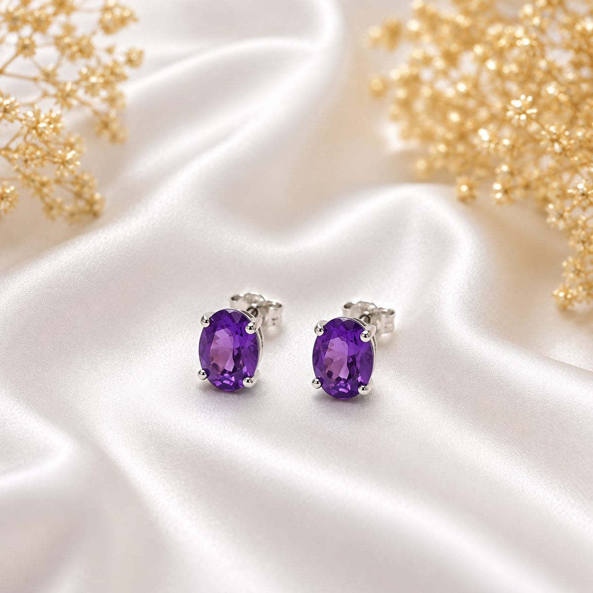 Oval purple Amethyst ear studs in 925 Sterling Silver with four-prong setting