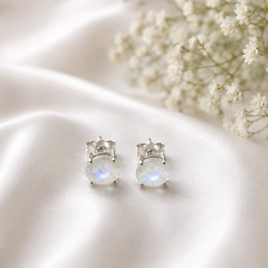 Oval white Moonstone ear studs in 925 Sterling Silver with four-prong setting