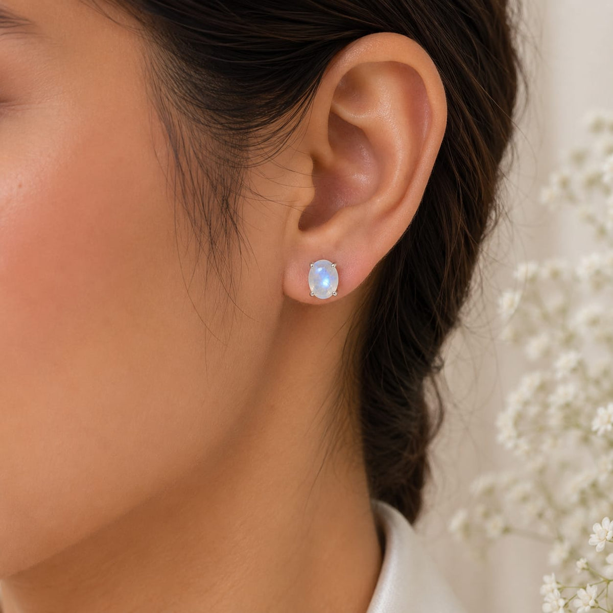 Oval white Moonstone ear studs in 925 Sterling Silver with four-prong setting