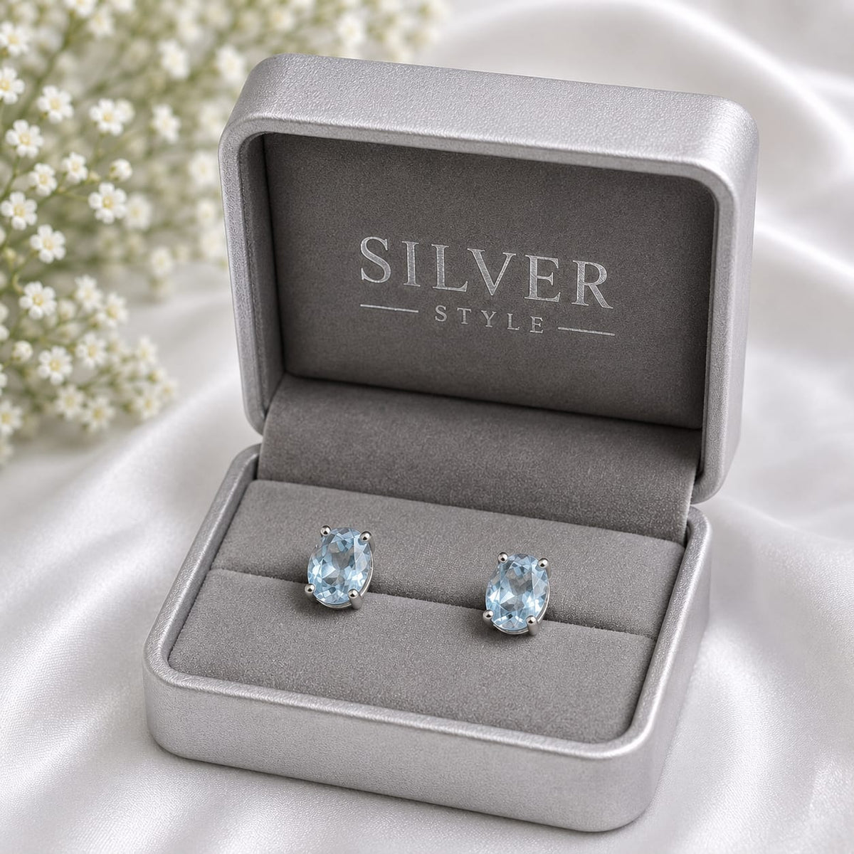 Oval blue Blue Topaz ear studs in 925 Sterling Silver with four-prong setting