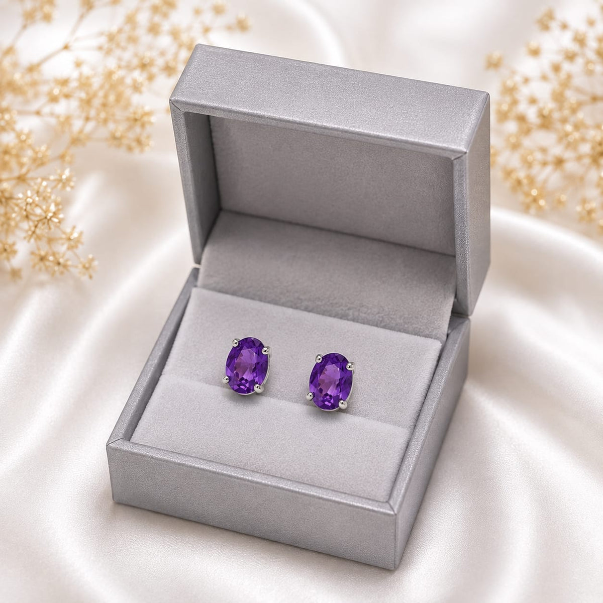 Oval purple Amethyst ear studs in 925 Sterling Silver with four-prong setting