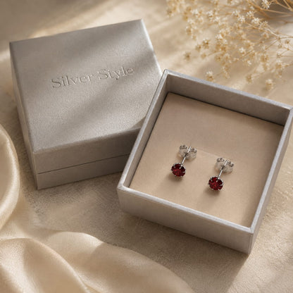 Deep red round Garnet stud earrings in 925 Sterling Silver with six-prong setting