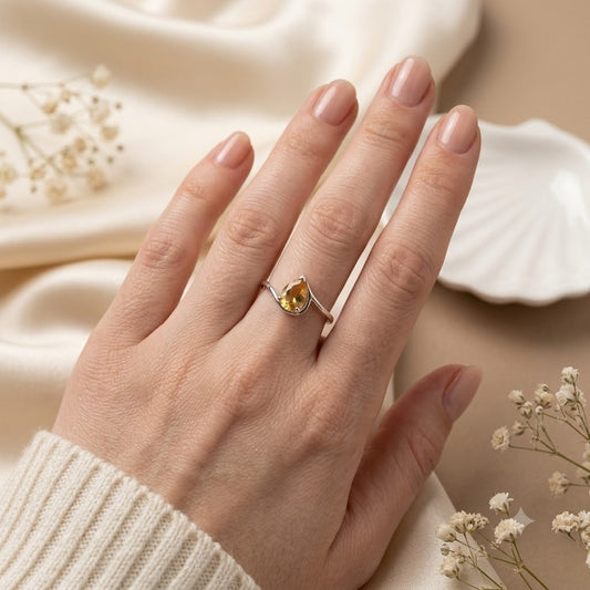 Pear Citrine Solitaire Ring crafted in 925 Sterling Silver with a natural pear cut Citrine gemstone.