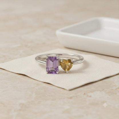 Twin Amethyst Ring in 925 Sterling Silver featuring an emerald cut purple Amethyst and a heart-shaped golden Citrine