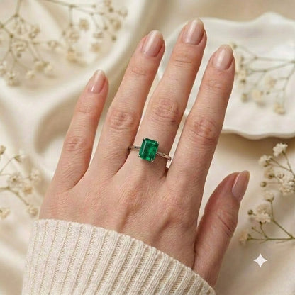 Rectangular Emerald Solitaire Ring crafted in 925 Sterling Silver with a green rectangular Emerald gemstone.