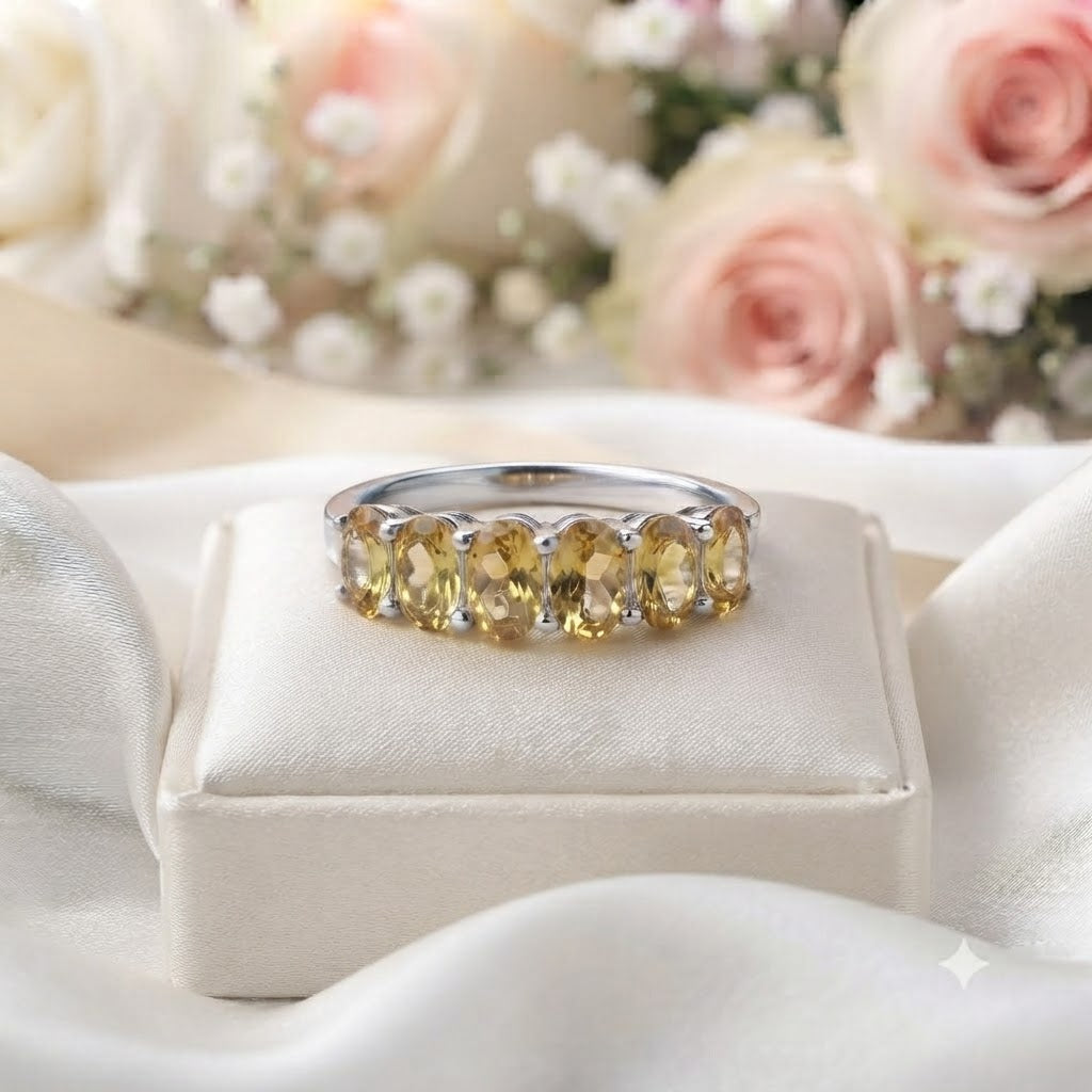 Band Citrine Ring crafted in 925 Sterling Silver featuring five oval cut Citrine gemstones.