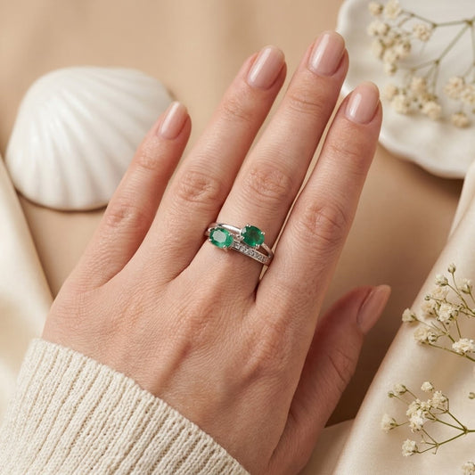Twin Emerald Ring crafted in 925 Sterling Silver with two green Emerald gemstones.