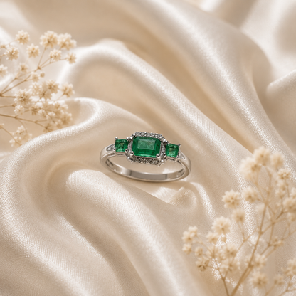 Three Stone Emerald Ring crafted in 925 Sterling Silver with three green Emerald gemstones.