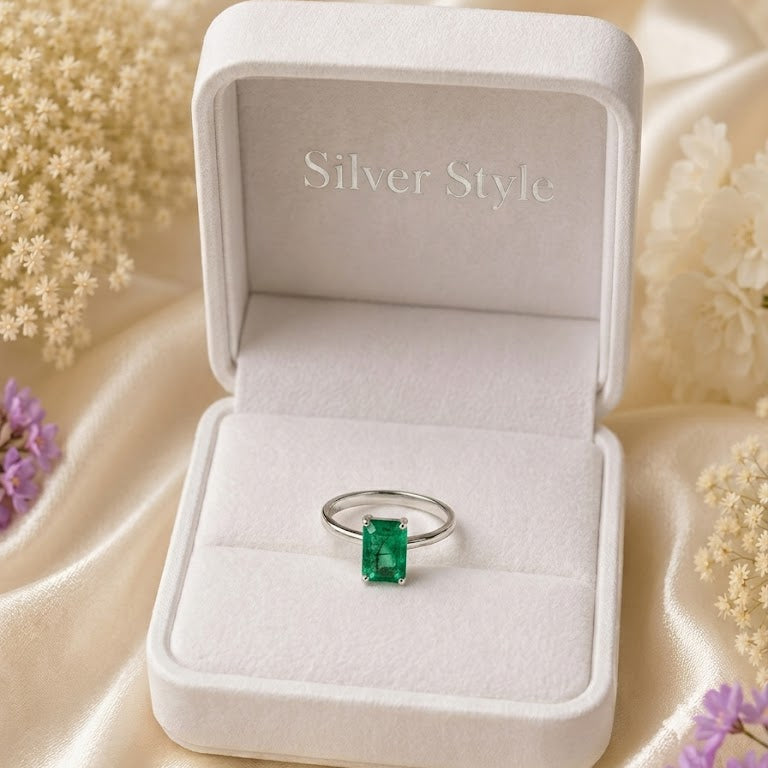 Rectangular Emerald Solitaire Ring crafted in 925 Sterling Silver with a green rectangular Emerald gemstone.