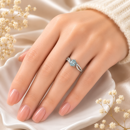 Oval Blue Topaz Ring crafted in 925 Sterling Silver with an oval cut sky blue gemstone in a four-prong setting and split shank design.