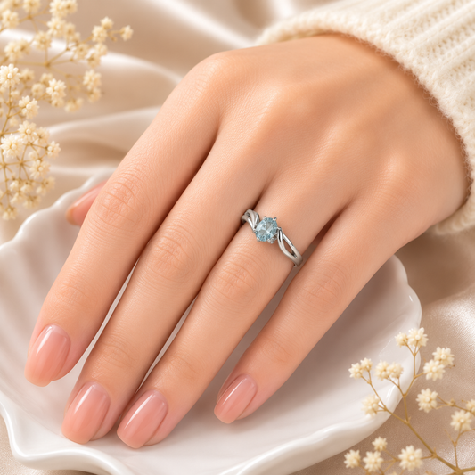 Oval Blue Topaz Ring crafted in 925 Sterling Silver with an oval cut sky blue gemstone in a four-prong setting and split shank design.