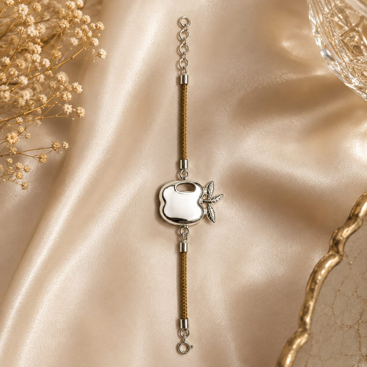 Apple charm bracelet on brown cord in 925 Silver