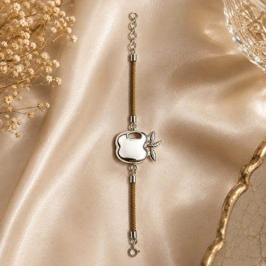 Apple charm bracelet on brown cord in 925 Silver