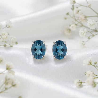 London Blue Topaz stud earrings in 925 sterling silver with oval blue gemstones