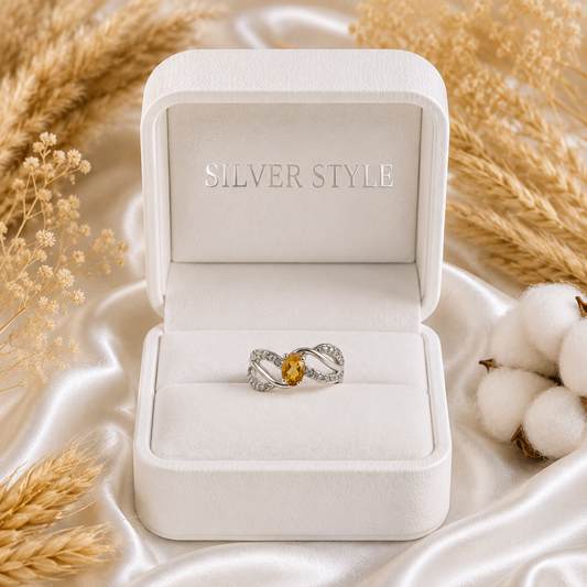 Intertwined Citrine Ring crafted in 925 Sterling Silver with a yellow oval cut Citrine gemstone and detailed silver design.