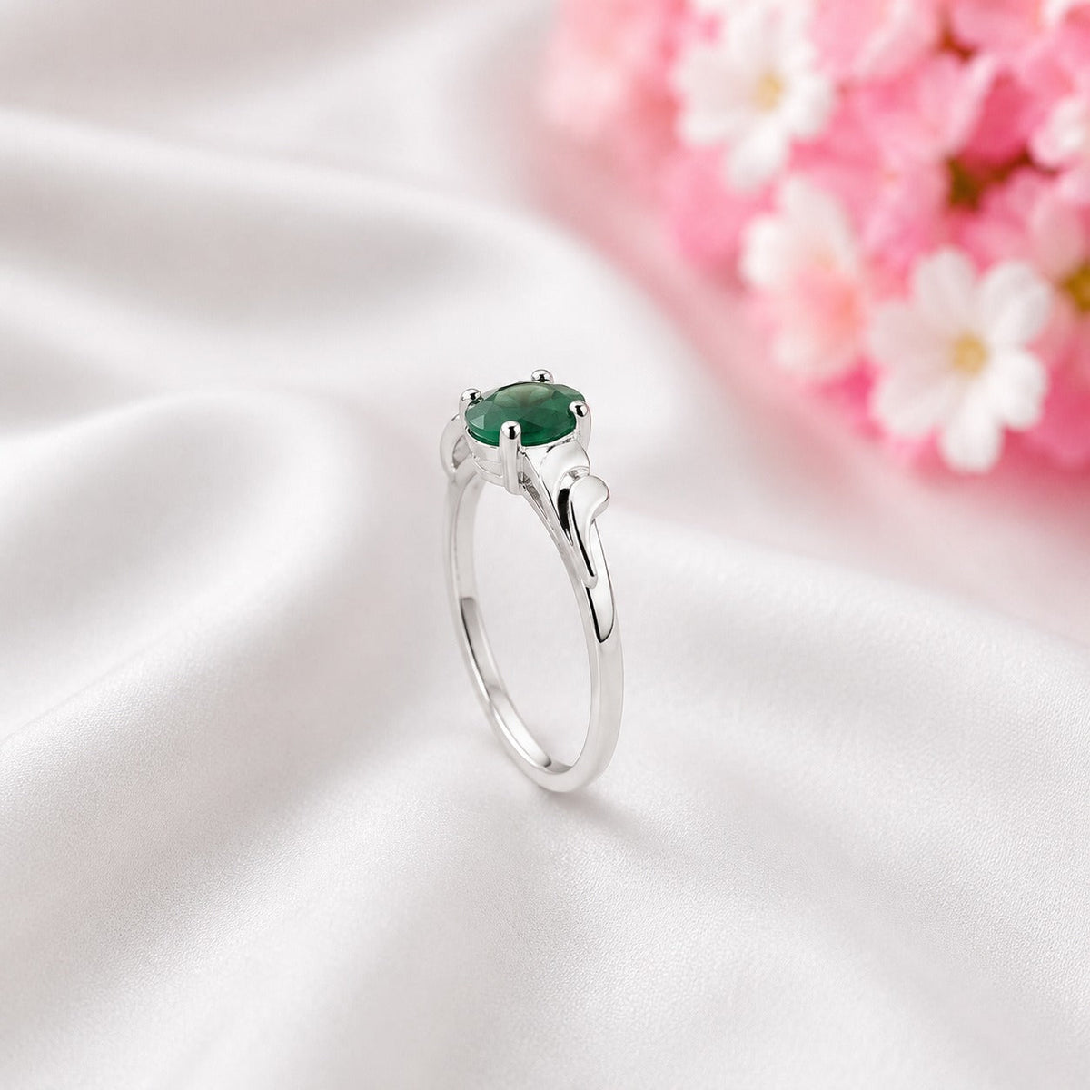 Curved Band Emerald Ring crafted in 925 Sterling Silver with a green oval cut Emerald gemstone.