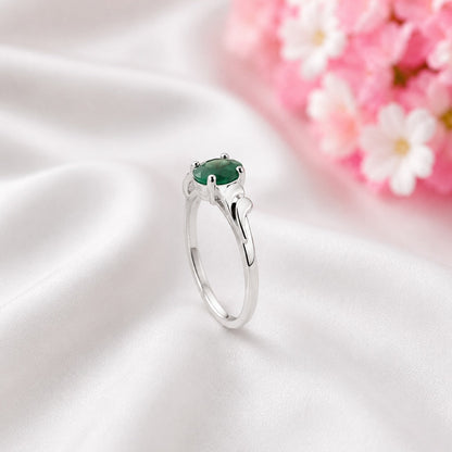 Curved Band Emerald Ring crafted in 925 Sterling Silver with a green oval cut Emerald gemstone.