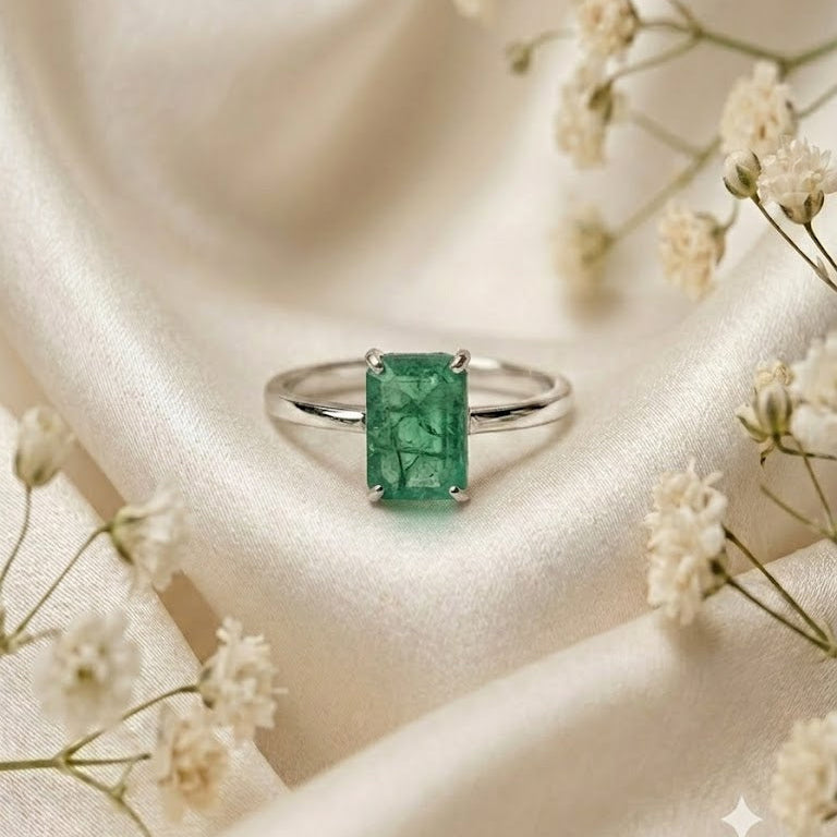 Rectangular Emerald Solitaire Ring crafted in 925 Sterling Silver with a green rectangular Emerald gemstone.