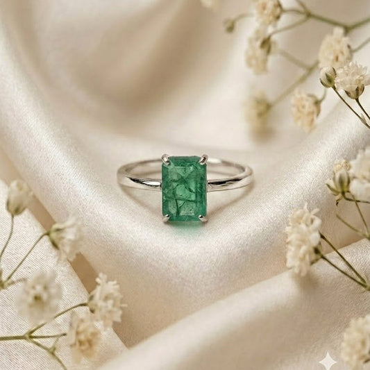 Rectangular Emerald Solitaire Ring crafted in 925 Sterling Silver with a green rectangular Emerald gemstone.