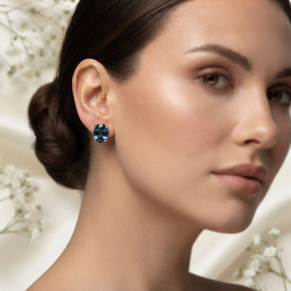 London Blue Topaz stud earrings in 925 sterling silver with oval blue gemstones