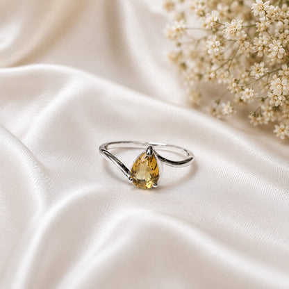 Pear Citrine Solitaire Ring crafted in 925 Sterling Silver with a natural pear cut Citrine gemstone.