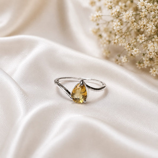 Pear Citrine Solitaire Ring crafted in 925 Sterling Silver with a natural pear cut Citrine gemstone.