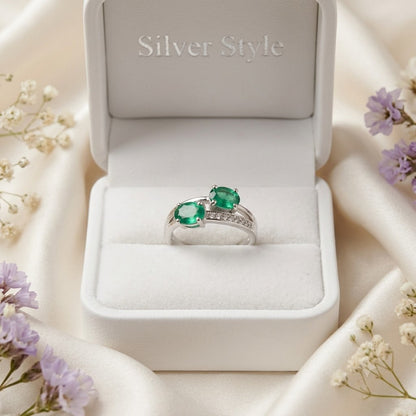 Twin Emerald Ring crafted in 925 Sterling Silver with two green Emerald gemstones.